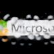 The Microsoft Corp. logo is seen through water droplets.